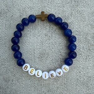Blue Beaded Bracelet with Gold Cross and White 'Believe' Beads